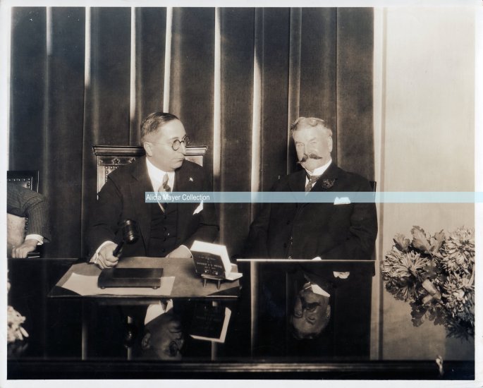 LB w unkown man at meeting